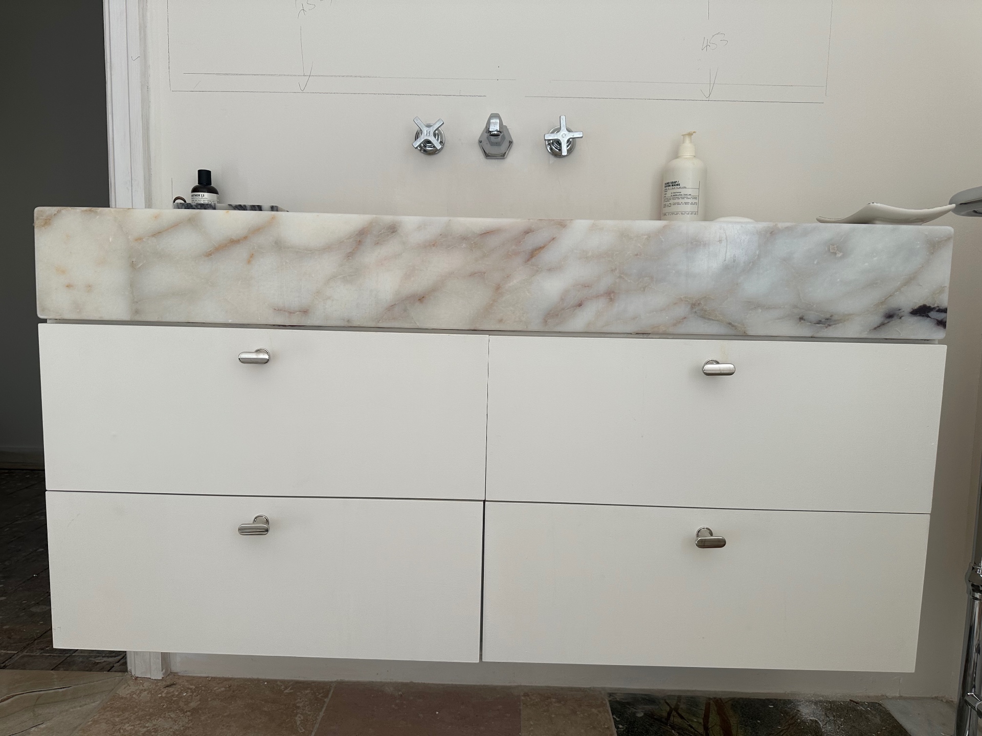 Marble vanity unit with chrome fittings