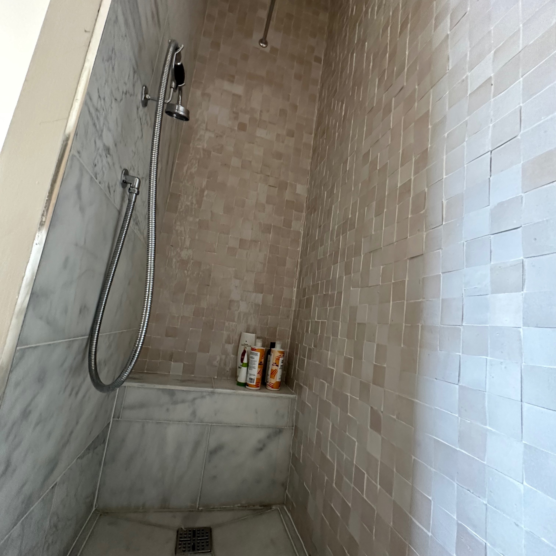Walk-in shower with zellige tiling