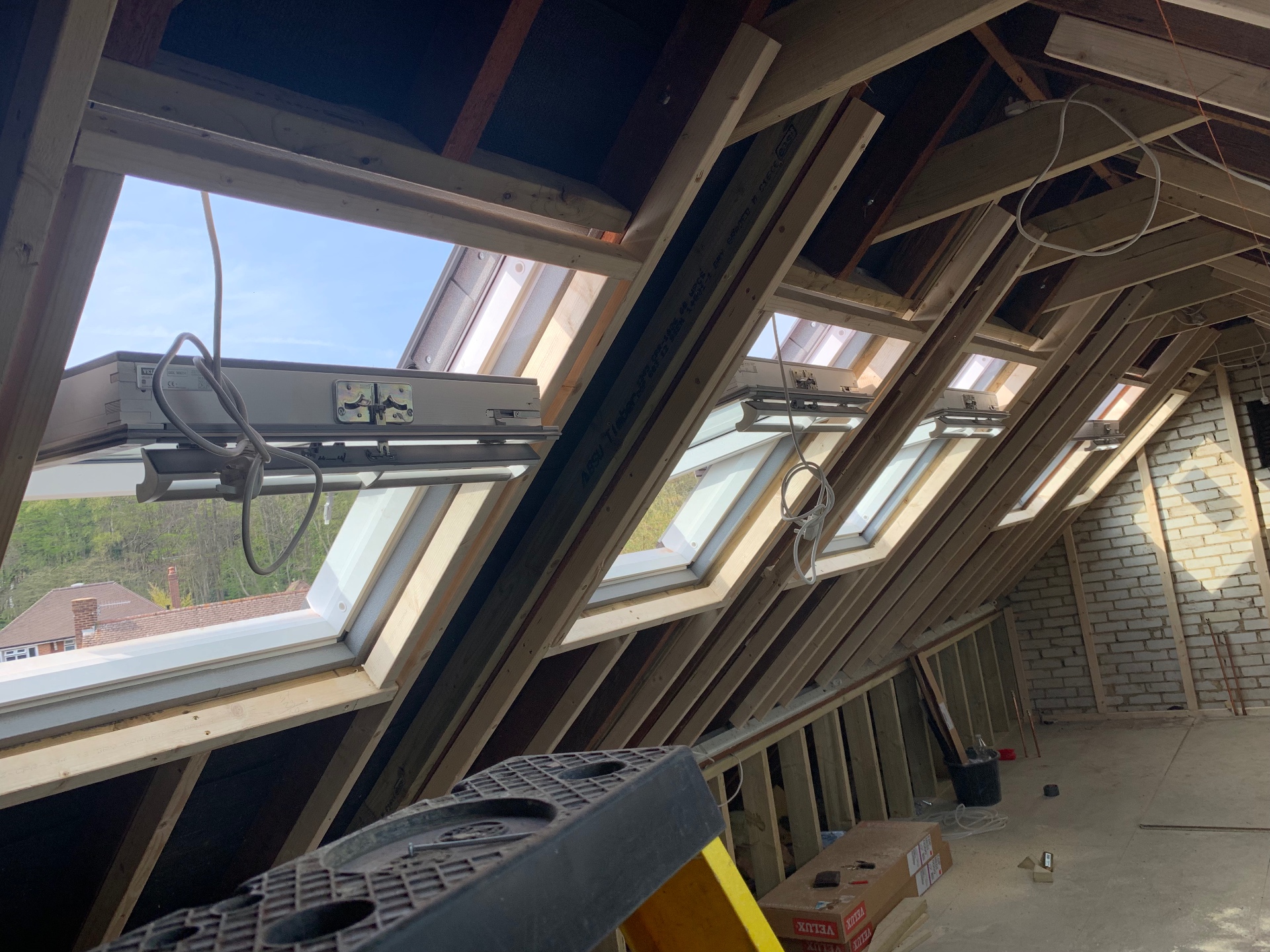 Finished loft conversion bedroom with skylight windows